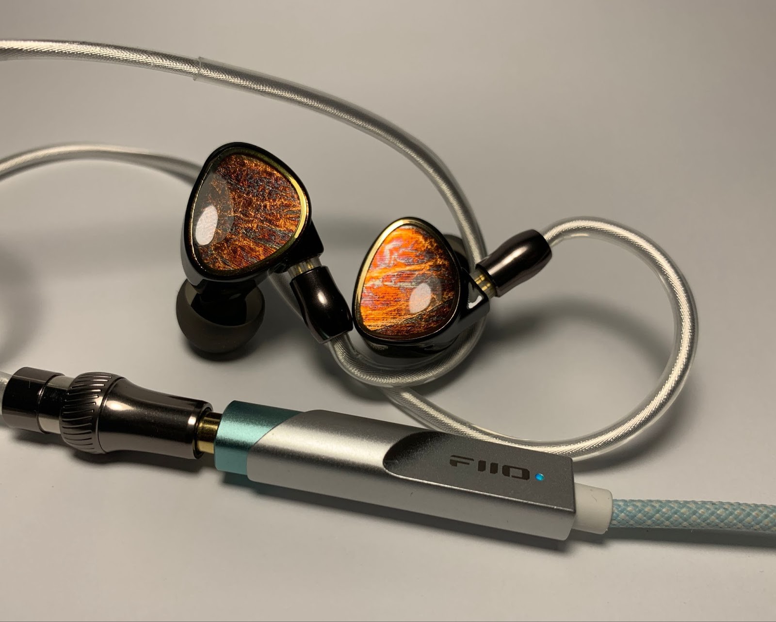 Shanling Tino Review: Warm, Musical, and Surprisingly Refined for Under $100 16 As for the Shanling Tino + FiiO KA11 combination , it demonstrates a light and airy delivery. Deep bass becomes less accentuated, while mid and high frequencies are drawn more clearly, which makes the sound, to some extent unexpectedly, more analytical.