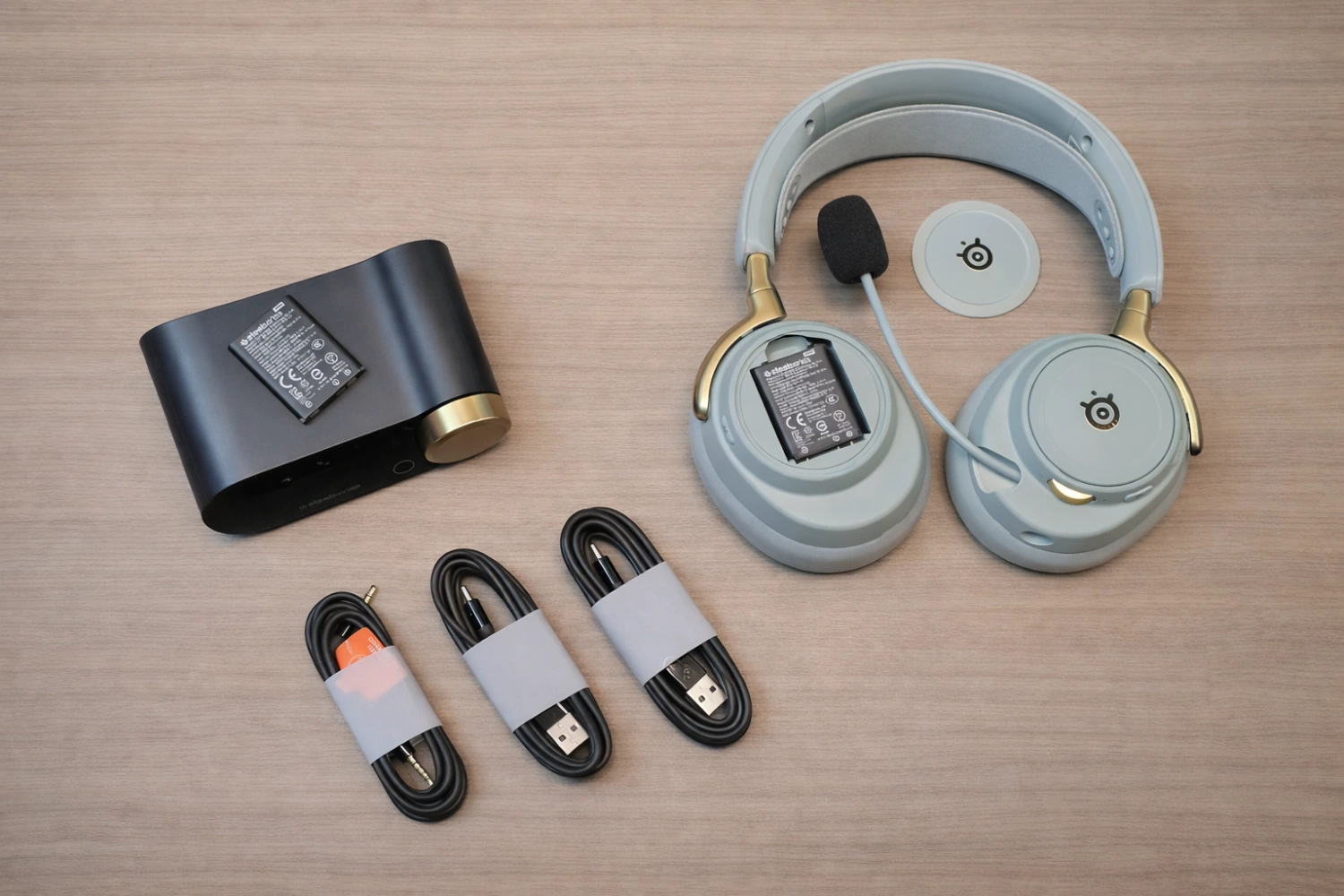 SteelSeries Arctis Nova Elite Review: Gaming Audio Goes Audiophile! 9 A complete ecosystem: headset, wireless base station, dual batteries, and neatly bundled cables ready for plug-and-play performance.